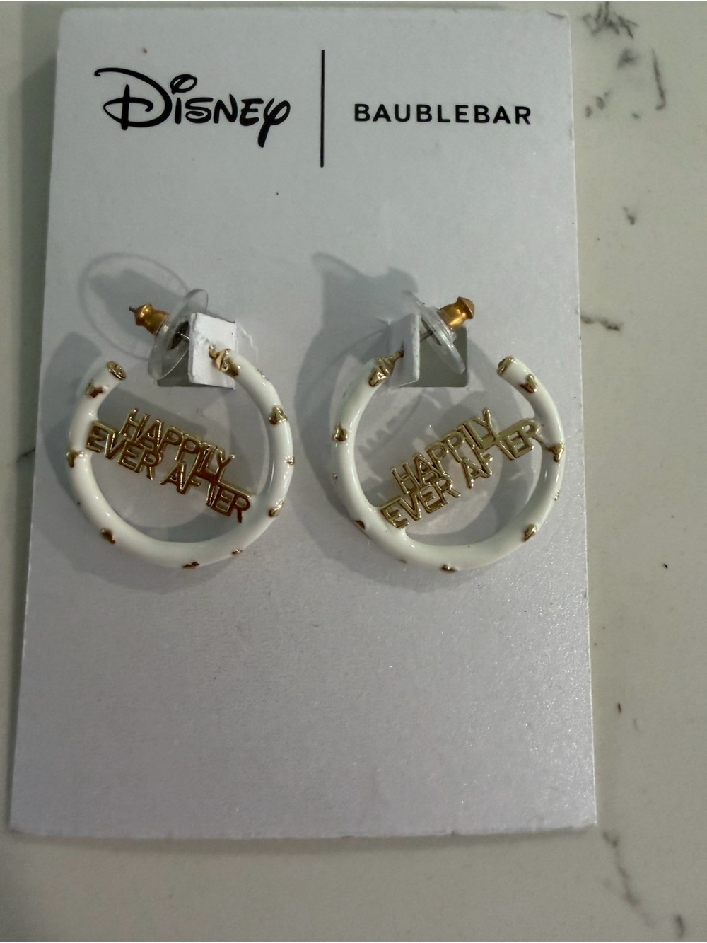 BaubleBar White and Gold Hoop Earrings with 'Happy Ever After' Charm